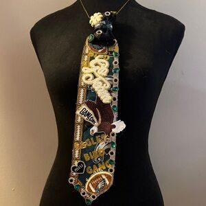 Unique Black and Gold Brooch with Green Accents